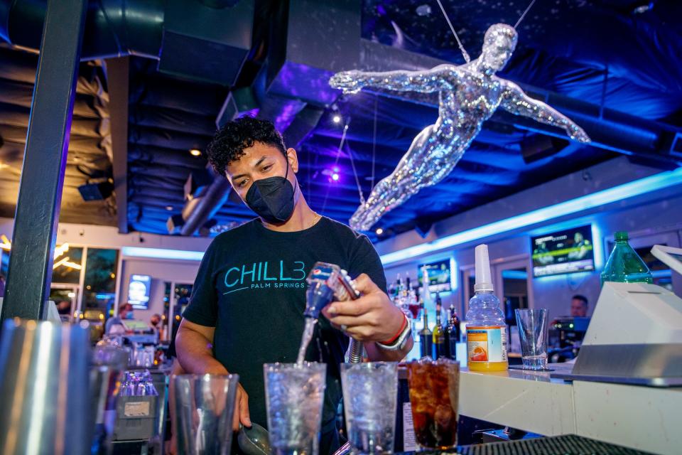 Bartender Masio Winston prepares a drink at Chill Bar in Palm Springs, Calif., on Friday, April 30, 2021. 