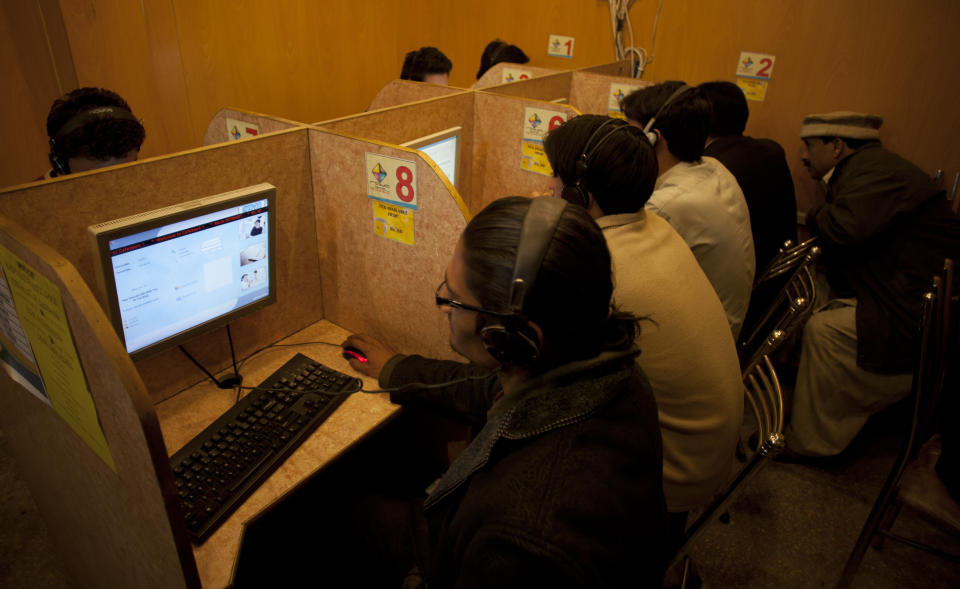 In this photo taken Wednesday, March 7, 2012, people use the Internet at a local cafe in Islamabad, Pakistan. Pakistan wants to install an Internet filtering system capable of blocking 50 million Web pages - and doesn't mind advertising the fact. The plan is alarming free speech activists who fear current censorship could become much more widespread. (AP Photo/B.K. Bangash)