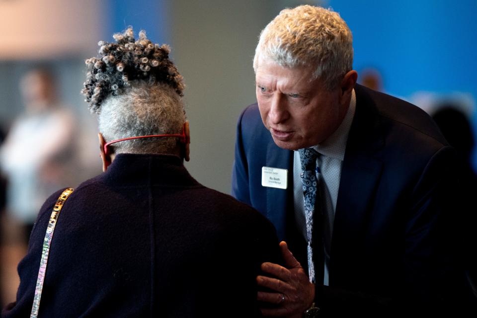 Ric Booth greets people during the Visit Cincy annual meeting at the Duke Energy Convention Center in January.