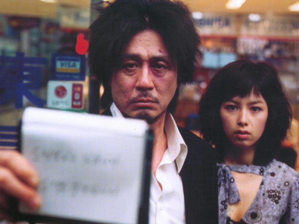 Choi Min-sik and Kang Hye-jung as Dae-su Oh and Mi-do in ‘OldBoy’ (2004) (Moviestore/Shutterstock)