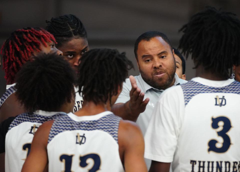 June 16, 2022; Glendale, Arizona; USA; head coach Obie Tann talks to his team during a game against Marcos de Niza in the Section 7 basketball tournament at State Farm Stadium.