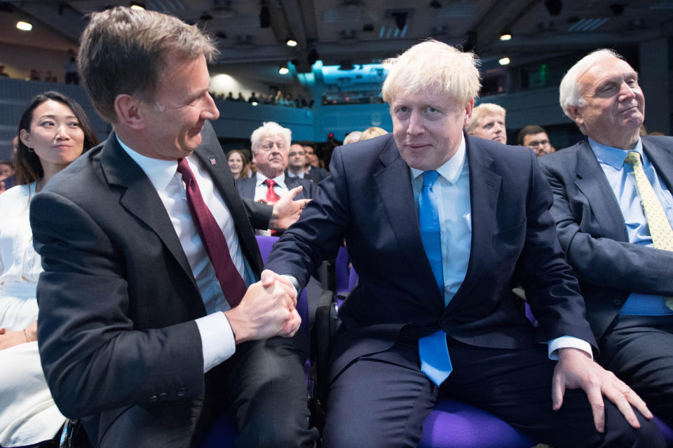 Jeremy Hunt (left) congratulates Boris Johnson at the Queen Elizabeth II Centre in London where he was announced as the new Conservative party leader, and will become the next Prime Minister.