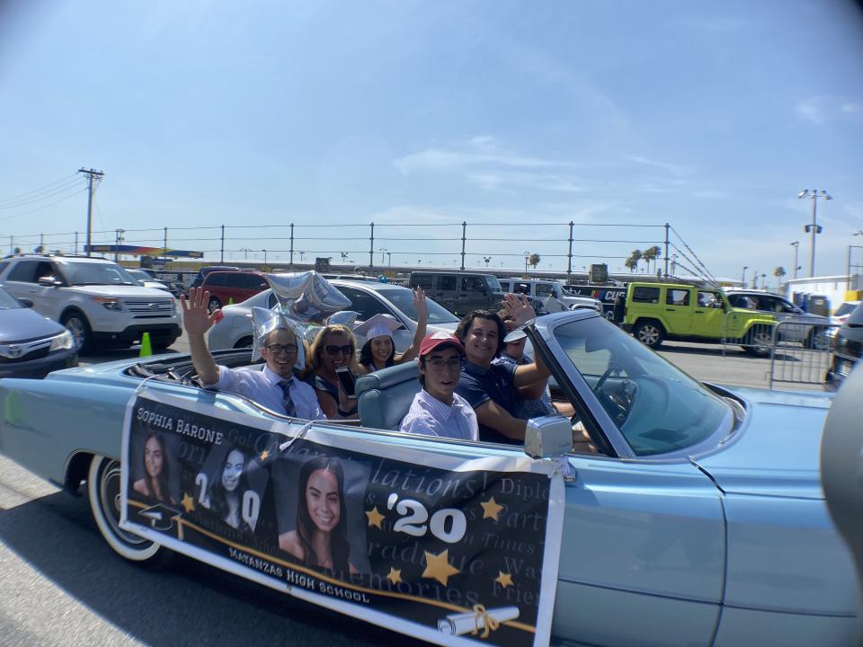 2020 graduates and their families lined up in their cars to receive their high school diplomas at Daytona International Speedway. (Photo: Jeff Reaves)