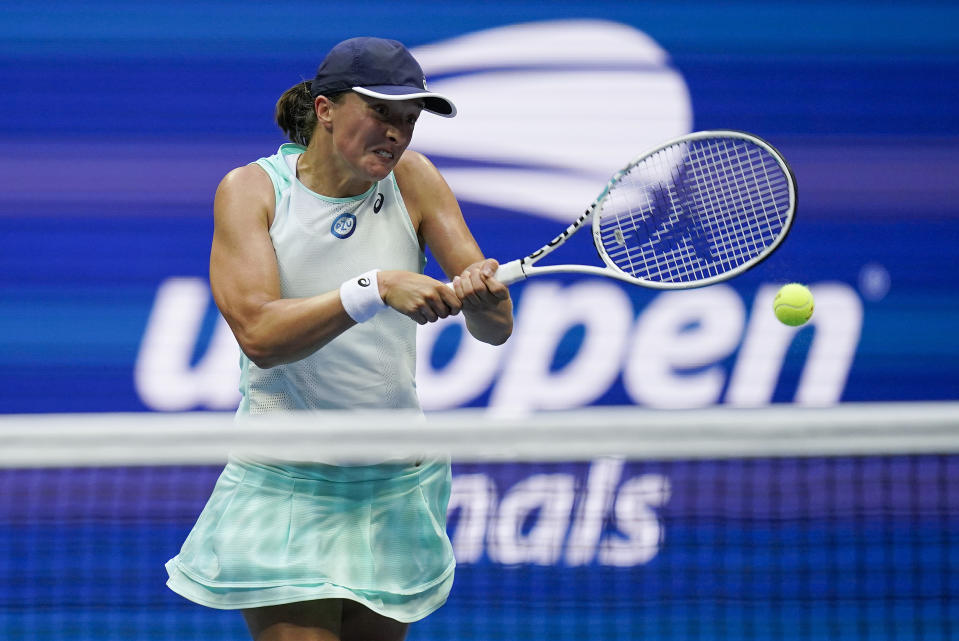 Iga Swiatek, of Poland, returns a shot to Ons Jabeur, of Tunisia, during the women's singles final of the U.S. Open tennis championships, Saturday, Sept. 10, 2022, in New York. (AP Photo/Charles Krupa)