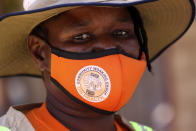 Community health worker, Rosemary Rambire is seen during a COVID-19 awareness campaign in Chitungwiza, on the outskirts of Harare, Wednesday, Sept. 23, 2020. As the Zimbabwe's coronavirus infections decline, strict lockdowns designed to curb the disease are being replaced by a return to relatively normal life. The threat has eased so much that many people see no need to be cautious, which has invited complacency. That worries some health experts. Rosemary Rambire says the improving figures and the start of the searing heat of the Southern Hemisphere’s summer could undermine efforts to beat back the virus even further. (AP Photo/Tsvangirayi Mukwazhi)