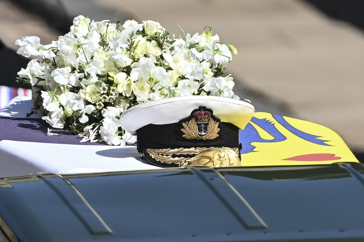 The Royal Navy cap sits on top of the coffin during the funeral of Britain's Prince Philip inside Windsor Castle in Windsor, England Saturday April 17, 2021.