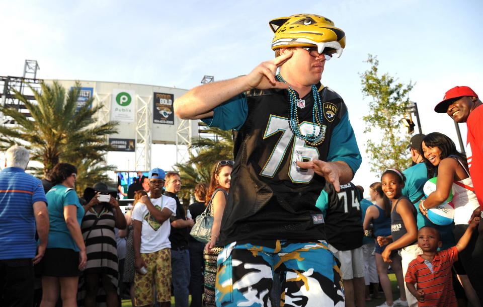 Jeremy Conn dances at the draft party wearing the jersey of Luke Joeckel the Jag's first pick in the 2013 draft. The Jacksonville Jaguars' 2014 NFL Draft Party was held at EverBank Field on Thursday May 8, 2014 Jacksonville, Florida. (AP Photo/Florida Times-Union/Bruce Lipsky)