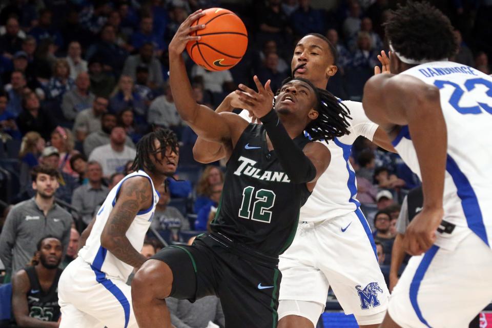 Feb 11, 2024; Memphis, Tennessee, USA; Tulane Green Wave guard Kolby King (12) drives to the basket during the second half against the Memphis Tigers at FedExForum.