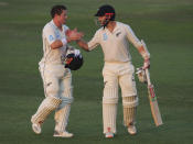 New Zealand's batsmen, Henry Nicholls, left, and Kane Williamson shakes hands as they leave the pitch at the end of forth day in their test match against Pakistan in Abu Dhabi, United Arab Emirates, Thursday, Dec. 6, 2018. (AP Photo/Kamran Jebreili)