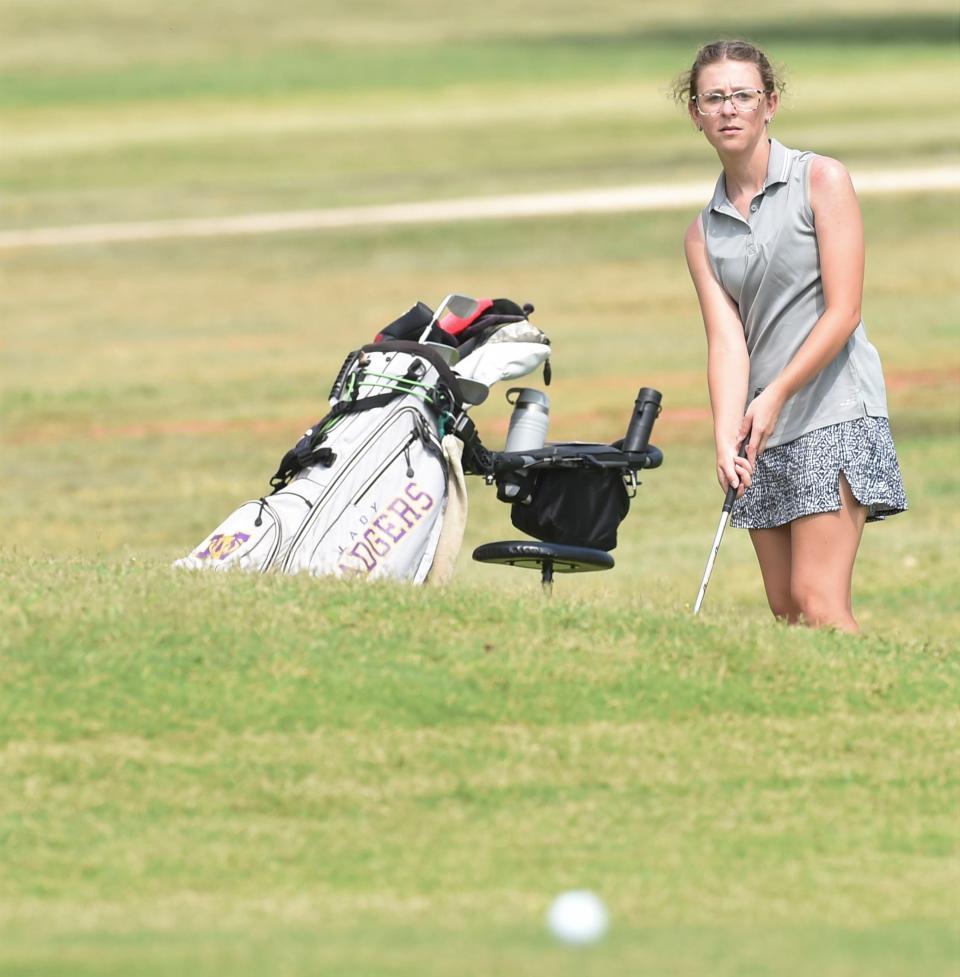 Merkel's Haylee Deen eyes her chip shot onto the green at No. 1 during the West Junior Champions Tour on Thursday at Maxwell Golf Course.