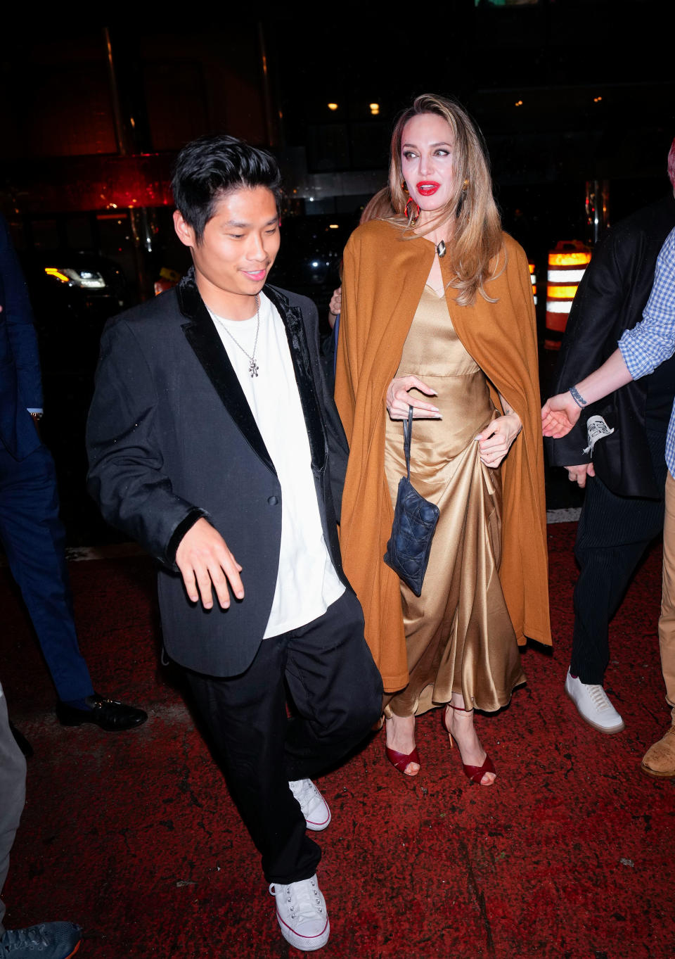 Angelina Jolie and Pax Jolie-Pitt arrive at the afterparty of "The Outsiders" 