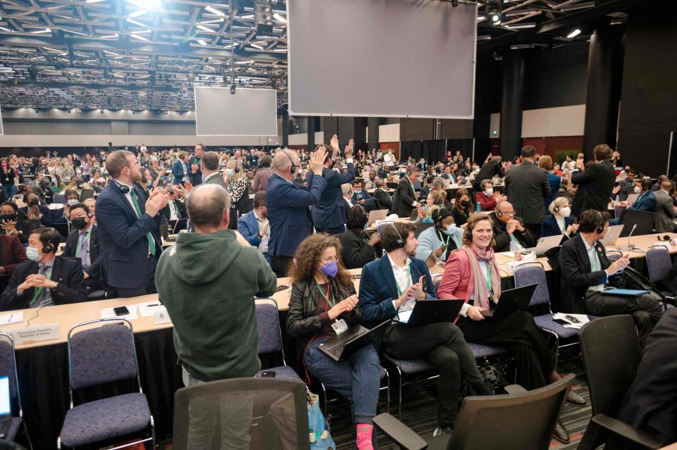 Delegates applaud after Mexico made a cris du coeur for delegates to reach an agreement during the plenary for the tail end of the United Nations Biodiversity Conference (COP15) in Montreal, Quebec, Canada on December 19, 2022.