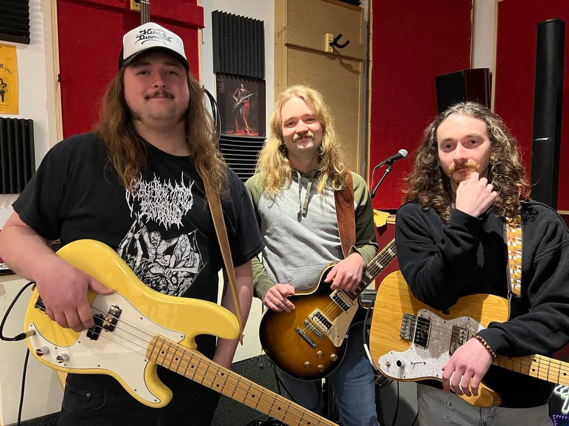 Stark County rock band Beach City Postal Service is shown in their rehearsal space in Sugar Creek Township. The band will be performing on March 16 at a Neil Young tribute concert at The Auricle in downtown Canton. From left are Russell Jones, Jake Buckridge and Dustin Mayle. Not pictured is T.J. Gang.