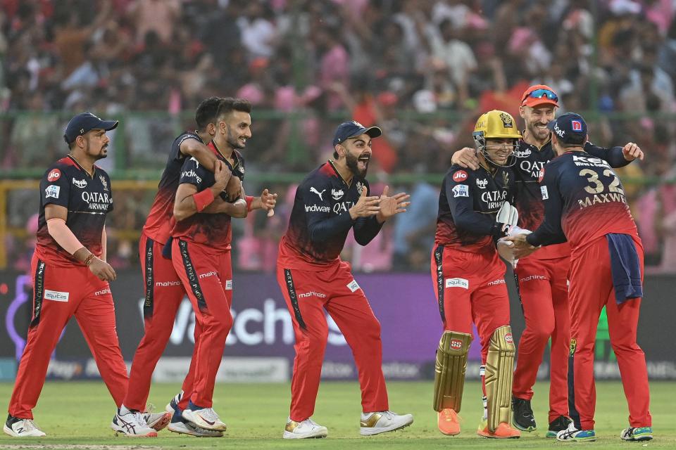 Royal Challengers Bangalore's players celebrate after winning the Indian Premier League (IPL) Twenty20 cricket match between Rajasthan Royals and Royal Challengers Bangalore at the Sawai Mansingh Stadium in Jaipur on May 14, 2023.