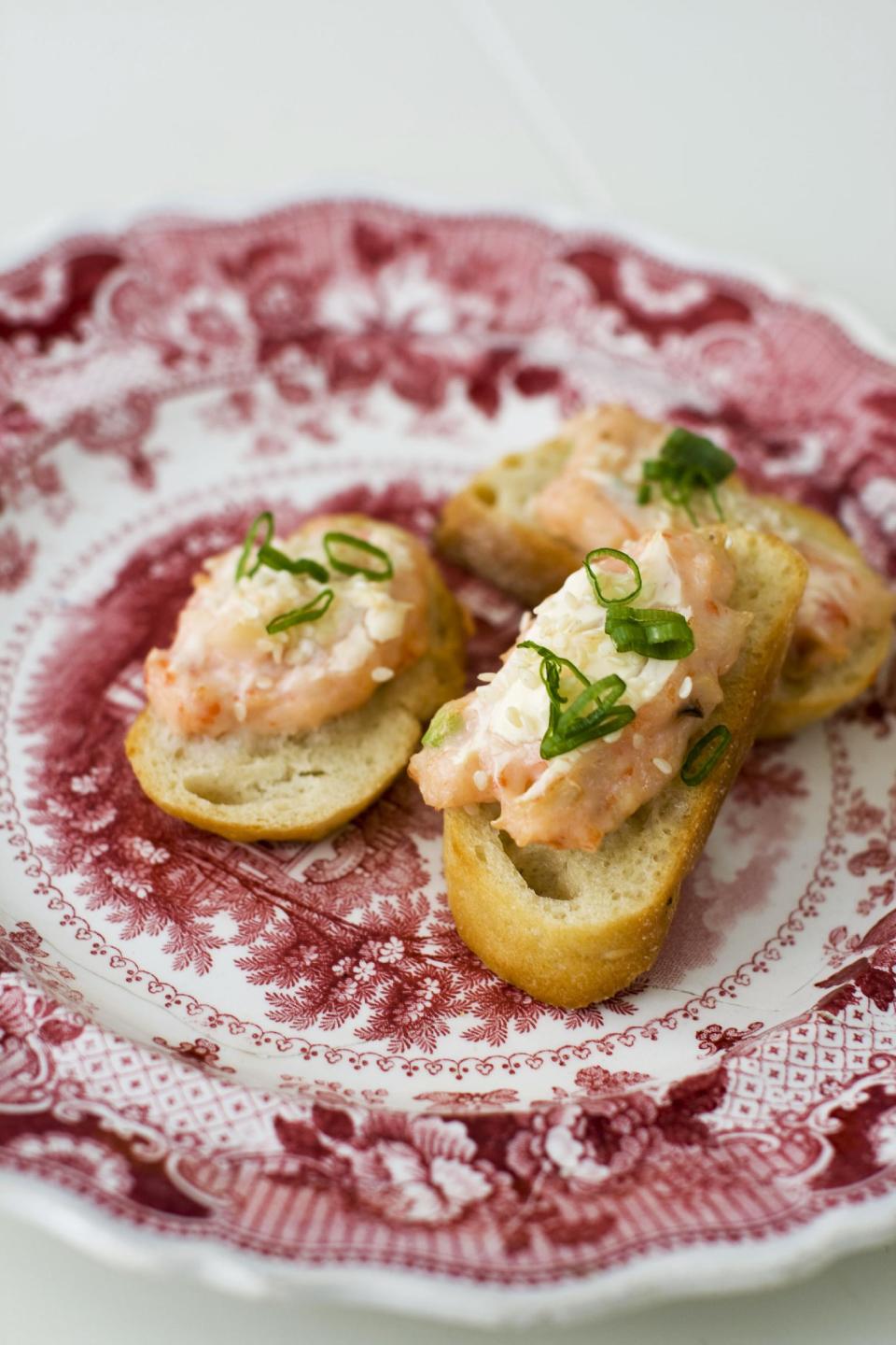 In this image taken on January 14, 2013, baked sesame shrimp toasts are shown served on a plate in Concord, N.H. (AP Photo/Matthew Mead)