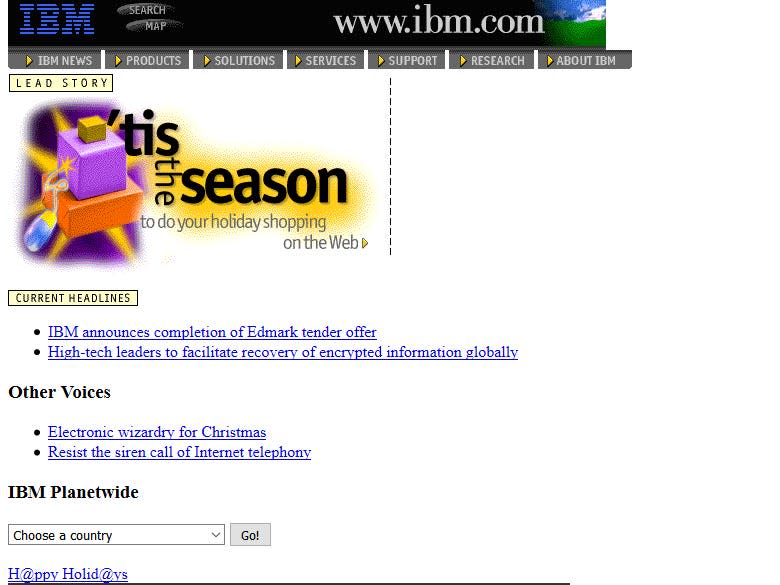 orange and purple blocks and the words "tis the season" on the IBM website in 1996