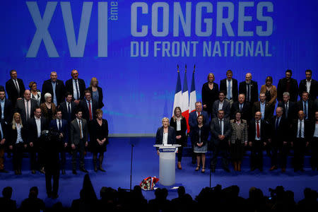 Marine Le Pen, National Front (FN) political party leader, sings the French national anthem at the end of National Front's congress in Lille, France, March 11, 2018. REUTERS/Pascal Rossignol
