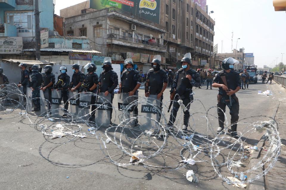 FILE - In this Oct. 2, 2019 file photo, Iraqi security forces close streets to prevent anti-government protesters from reaching Tahrir Square in central Baghdad, Iraq. The protests have plunged the country into a new cycle of instability since last week, one that could potentially be the most dangerous this conflict-scarred nation has had to face, with more than 100 killed in less than a week. Iraqi security forces have been shooting at young Iraqis demanding jobs, electricity and clean water and an end to corruption. (AP Photo/Khalid Mohammed, File)