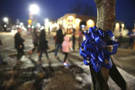People line the street for the procession from a Rockford, Ill. hospital to the funeral home Friday, March 8, 2019, in Huntley, Ill., for fallen McHenry County Sheriff's Deputy Jacob Keltner. An Illinois man faces federal murder charges in the shooting death of the sheriff's deputy that led to an hourslong standoff with police along an interstate. (Patrick Kunzer/Daily Herald via AP)