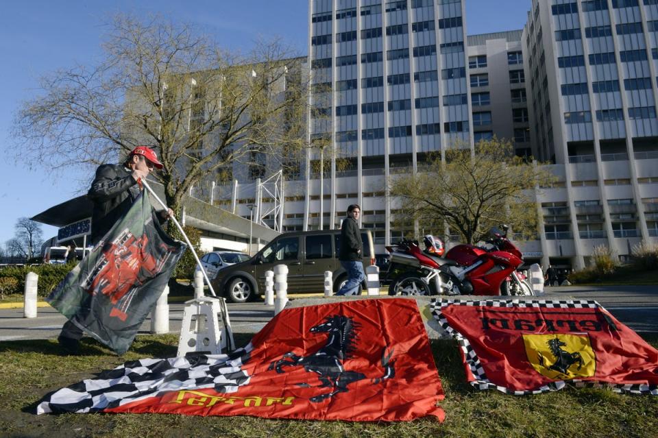 Ferrari flags were left by fans outside Grenoble University Hospital Centre following the December 2013 accident (AFP/Getty)