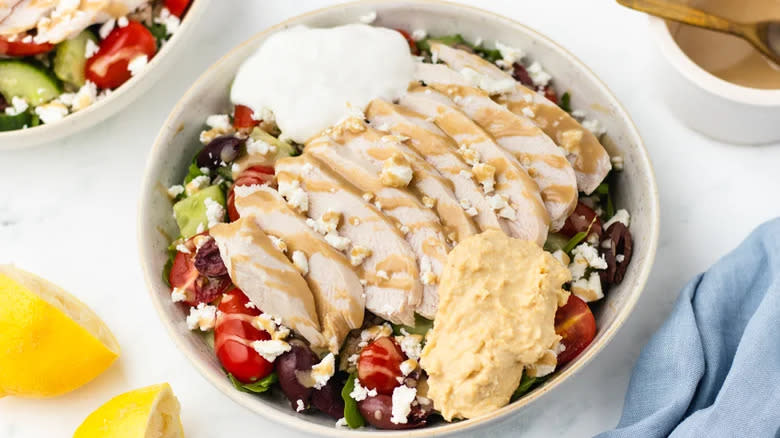 Chicken with salad and hummus