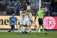 Los Angeles FC players, mob, forward Carlos Vela, obscured, after Vela's goal during the first half of an MLS soccer match against Dallas FC Wednesday, June 23, 2021, in Los Angeles. (AP Photo/Marcio Jose Sanchez)