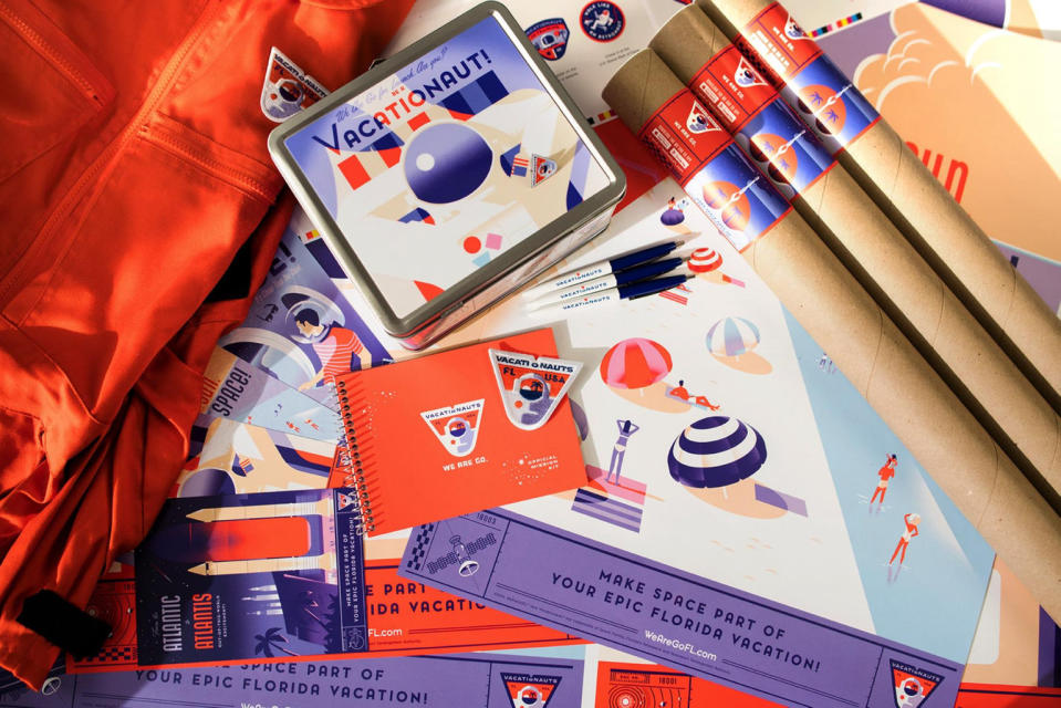 The Vacationauts mission starter kit comes with a vintage-style metal lunch box, a booklet, four postcards, astronaut ice cream (freeze-dried Neapolitan flavored), a Vacationaut pin, one mission badge, a sticker and a pen. <cite>WeAreGoFL</cite>