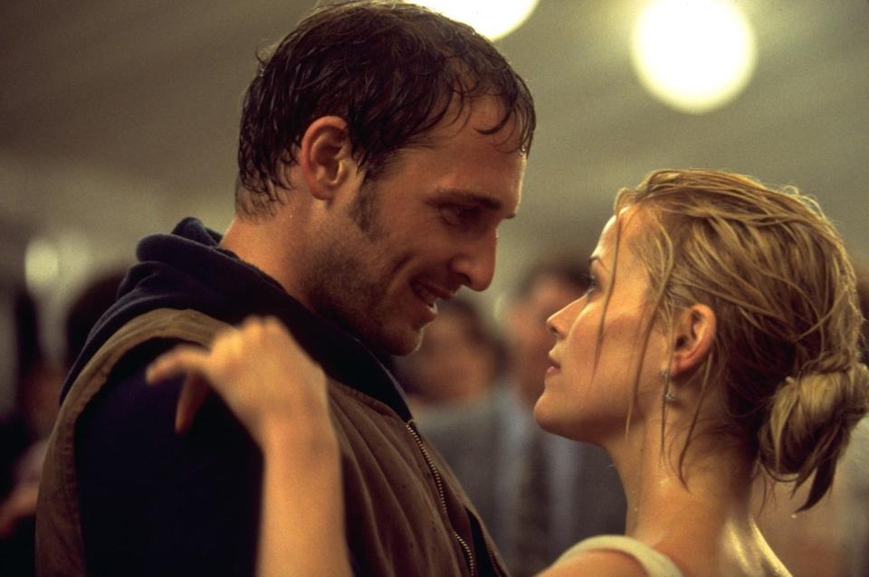 Josh Lucas and Reece Witherspoon stare lovingly at one another while dripping wet from the rain in a scene from "Sweet Home Alabama"