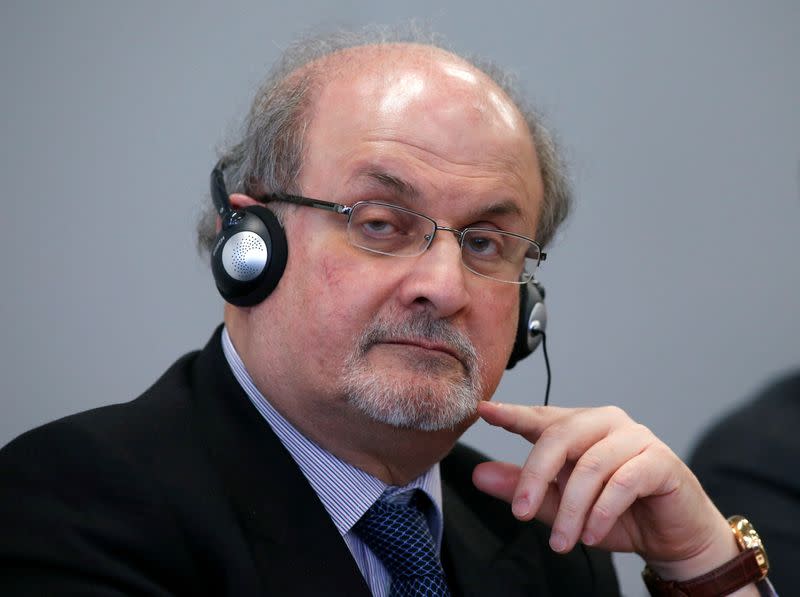 FILE PHOTO: Author Rushdie listens during the opening news conference of the Frankfurt book fair