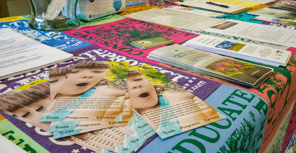 Various pamphlets and educational materials cover a table at a conservation symposium hosted by Trout Lake Nature Center in Eustis on Saturday, April 30, 2022. [PAUL RYAN / CORRESPONDENT]