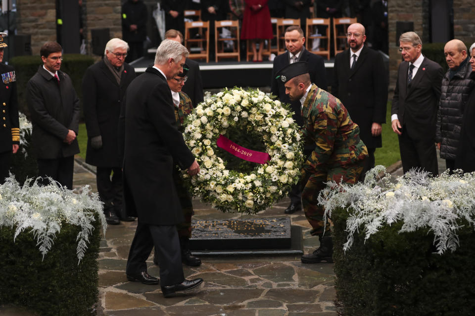 Belgium's King Philippe, front, puts a wreath to pay tribute next to U.S. Secretary of Defence Mark Esper, left, German President Frank-Walter Steinmeier, second left, Poland's President Andrej Duda, fourth right, European Council President Charles Michel, third right, and other authorities during a ceremony to commemorate the 75th anniversary of the Battle of the Bulge at the Mardasson Memorial in Bastogne, Belgium on Monday, Dec. 16, 2019. The Battle of the Bulge, also called Battle of the Ardennes, took place between Dec. 1944 and Jan. 1945 and was the last major German offensive on the Western Front during World War II. (AP Photo/Francisco Seco)