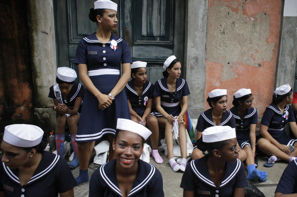 In this Nov. 3, 2018 photo, students wait for their chance to march during independence day parade, in Panama City's historic neighborhood, Casco Viejo. The Central American country begins a month of patriotic celebrations, marking the Nov. 3, 1903 separation from Colombia, and ends with commemorating their Nov. 28, 1821 independence from Spain. (AP Photo/Arnulfo Franco)