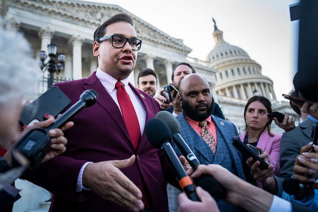 <p>Jabin Botsford/The Washington Post via Getty</p> New York Rep. George Santos speaks to reporters after initial calls to expel him in May were forwarded to the House Ethics Committee
