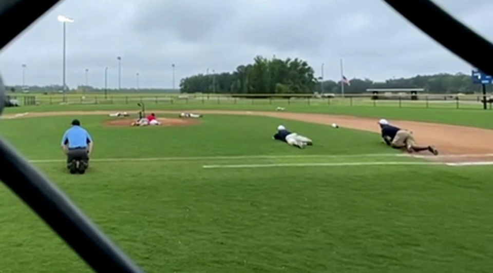 Little Leaguers in Wilson, North Carolina were forced to hit the ground when they suddenly heard gunshots ringing out during a game (WITN/video screengrab)