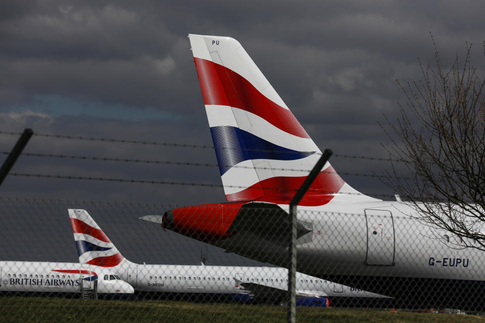 The British Airways livery sits on the tail fins of passenger aircraft, operated by British Airways, a unit of International Consolidated Airlines Group SA (IAG). Photo: Simon Dawson/Bloomberg