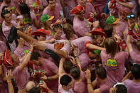 <p>Revellers party after the launch of the <em>chupinazo</em> rocket to celebrate the official opening of the 2017 San Fermín Fiesta. (Photo: Alvaro Barrientos/AP) </p>