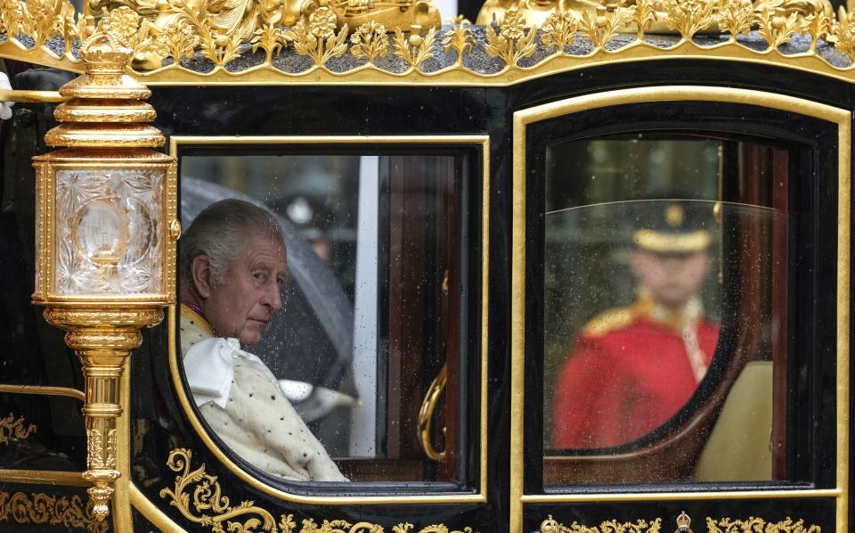 Britain's King Charles III makes his way to Westminster Abbey prior to his coronation ceremony in London Saturday, May 6, 2023. (AP Photo/Alessandra Tarantino)