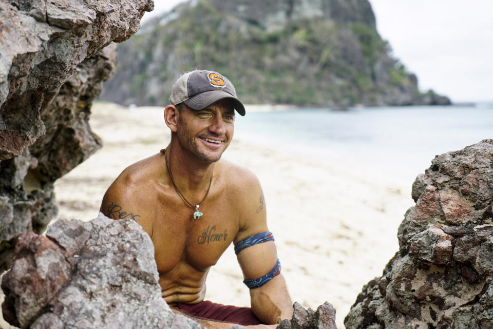 Brad Culpepper sits between some rocks