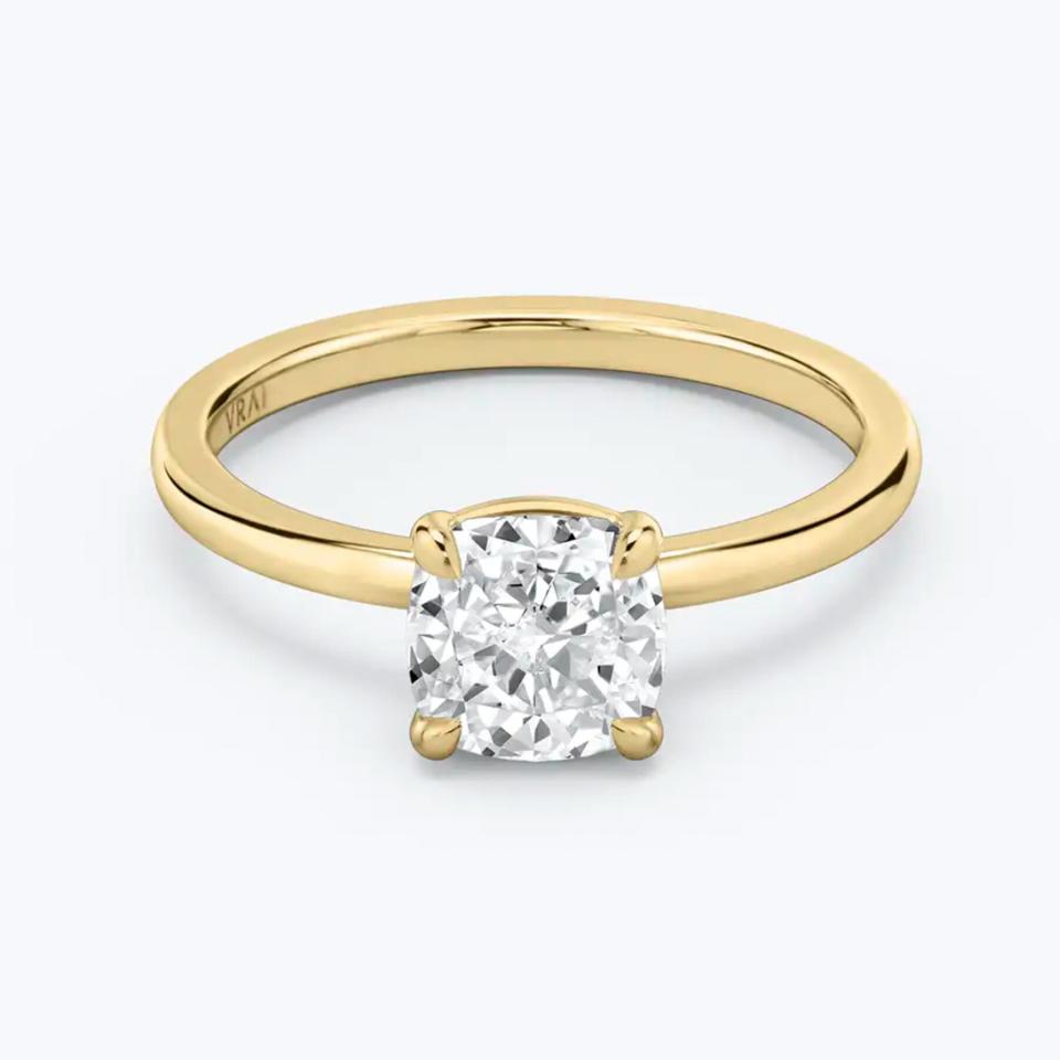 Engagement Ring Trends 2021: Vrai sustainable ethical diamonds, yellow gold and white cushion cut solitaire diamond ring