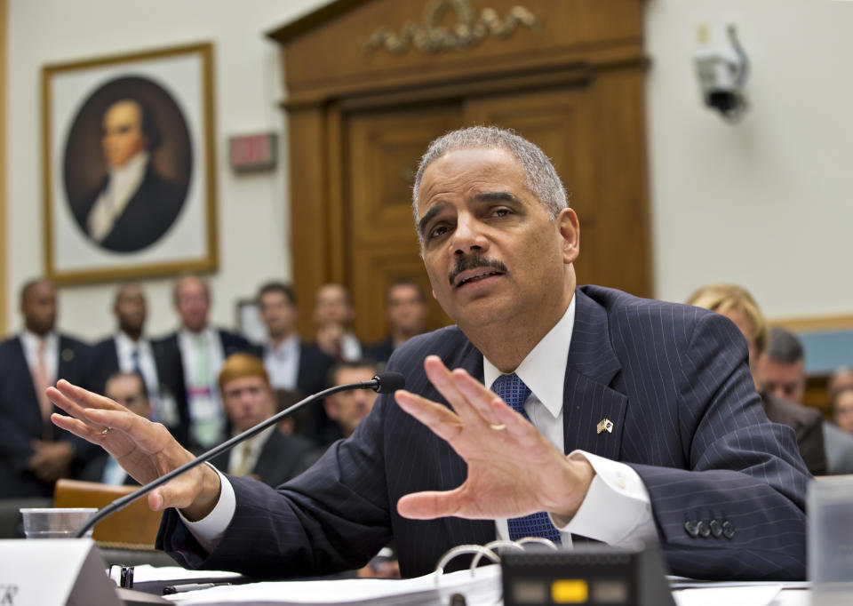 Attorney General Eric Holder gestures as he testifies on Capitol Hill in Washington, Wednesday, May 15, 2013, before the House Judiciary Committee as it focuses on oversight of the Justice Department. Holder told the committee that a serious national security leak required the secret gathering of telephone records at The Associated Press as he stood by an investigation in which he insisted he had no involvement. (AP Photo/J. Scott Applewhite)