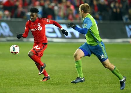 Dec 10, 2016; Toronto, Canada; Toronto FC forward Tosaint Ricketts (87) moves the ball against Seattle Sounders defender Chad Marshall (14) during overtime in the 2016 MLS Cup at BMO Field. Mandatory Credit: Mark J. Rebilas-USA TODAY Sports