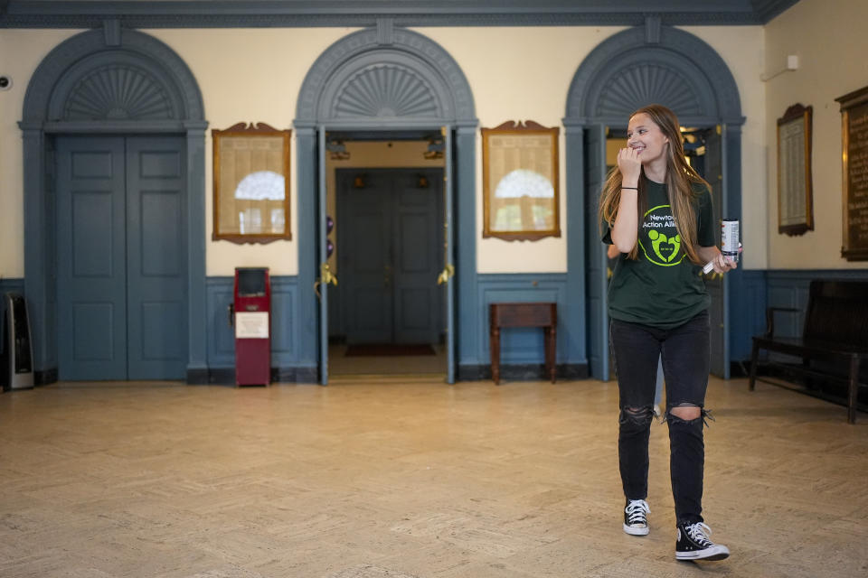 Lilly Wasilnak, a survivor of the 2012 Sandy Hook Elementary School shooting, arrives at a rally against gun violence on Friday, June 7, 2024 in Newtown, Conn. (AP Photo/Bryan Woolston)