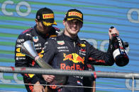 Red Bull driver Max Verstappen, front, of the Netherlands, celebrates after winning the Formula One U.S. Grand Prix auto race at Circuit of the Americas, Sunday, Oct. 24, 2021, in Austin, Texas. (AP Photo/Darron Cummings)