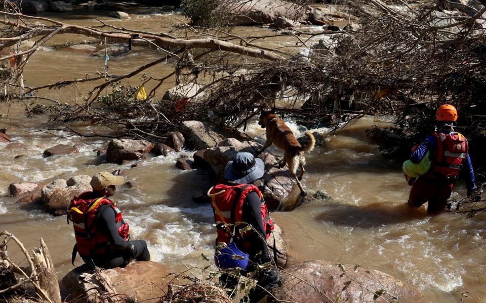 Search and rescue team looking for bodies at Umzinyathi Falls after floods, in Inanda near Durban, South Africa, Tuesday, April 19, 2022 - AP Photo