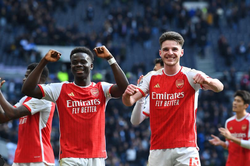 Bukayo Saka and Declan Rice celebrate Arsenal's victory over Tottenham Hotspur