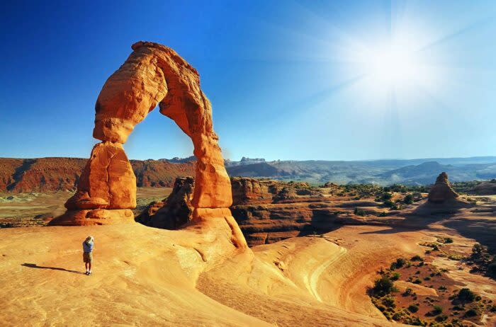 A tourist in Arches National Park. Travel and tourism have led 2022 growth of the outdoor industry, a new report says; (photo/Shutterstock)