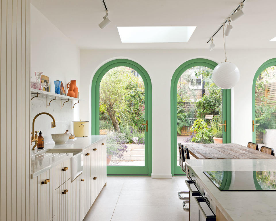 White kitchen with green painted door frames