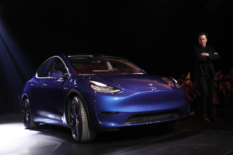 Elon Musk, co-founder and chief executive officer of Tesla Inc., speaks during an unveiling event for the Tesla Model Y crossover electric vehicle in Hawthorne, California, U.S., on Friday, March 15, 2019. Musk said the cheaper electric crossover sports utility vehicle (SUV) will be available from the spring of 2021. The vehicle's price will start at $39,000, a longer-range version will cost $47,000. Photographer: Patrick T. Fallon/Bloomberg via Getty Images