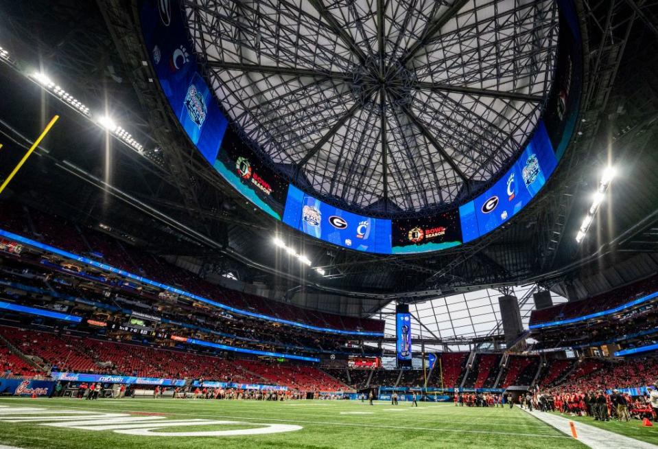 Cheer on the Falcons at Mercedes-Benz Stadium.