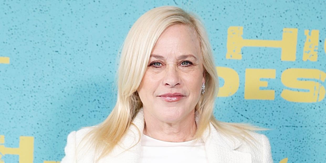 patricia arquette wears a white suit at a premiere event